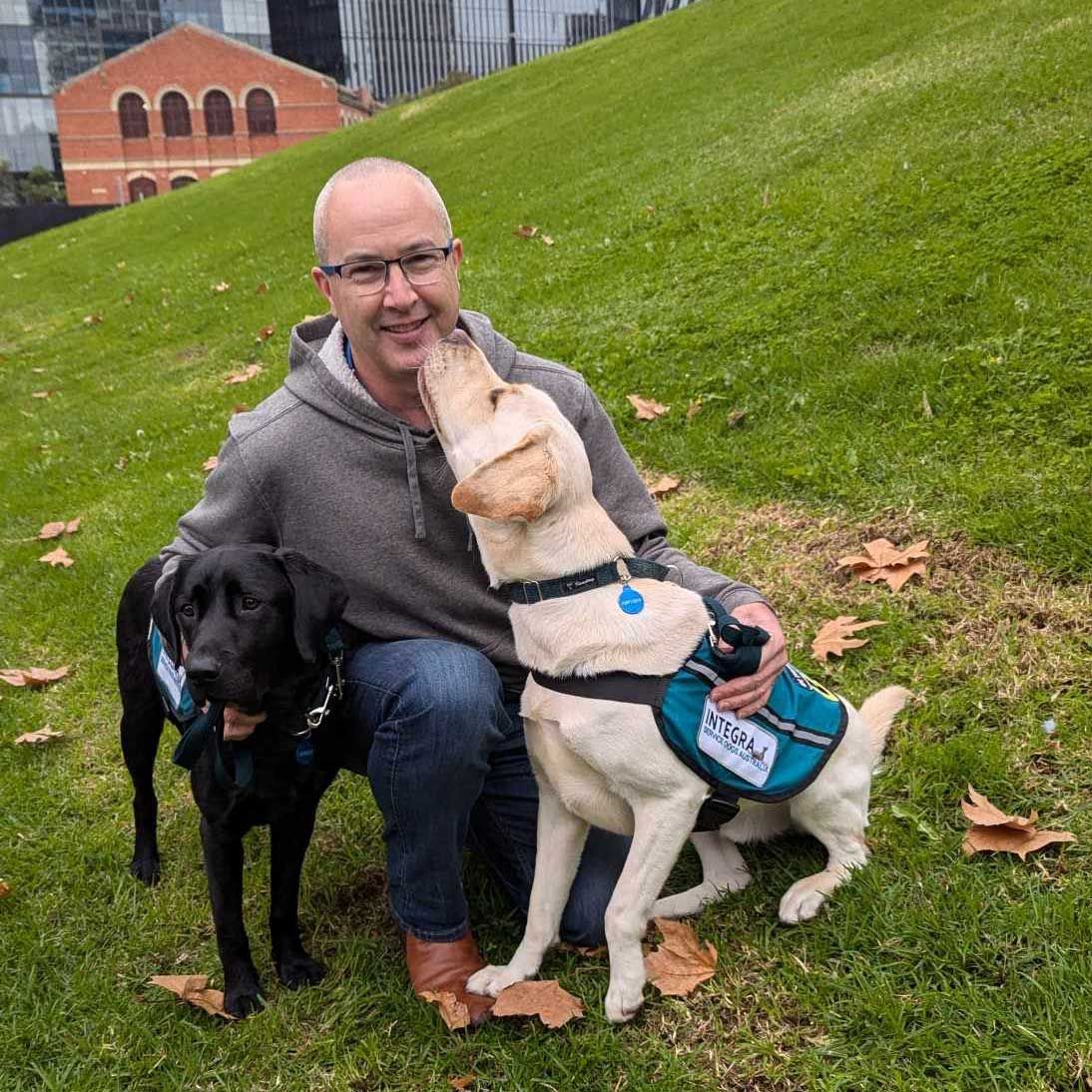 Code 9 President, Mark Thomas (Middle), with Integra PTSD Dogs, Gregory (Left) & Spencer (Right)